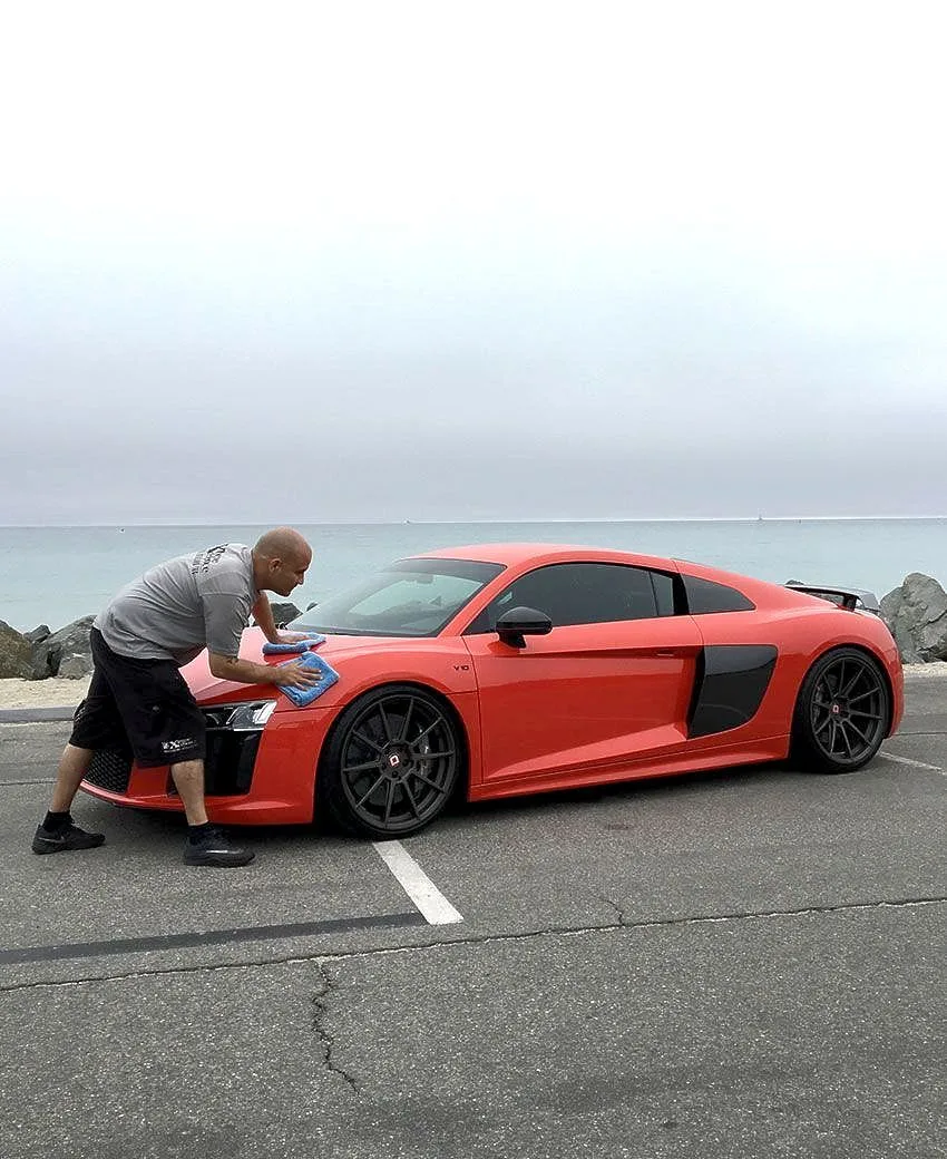 Vehicle detailed outdoors near the coast